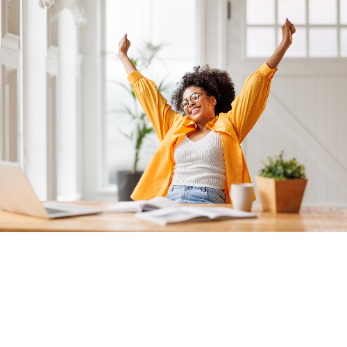 women celebrating while seating at her desk